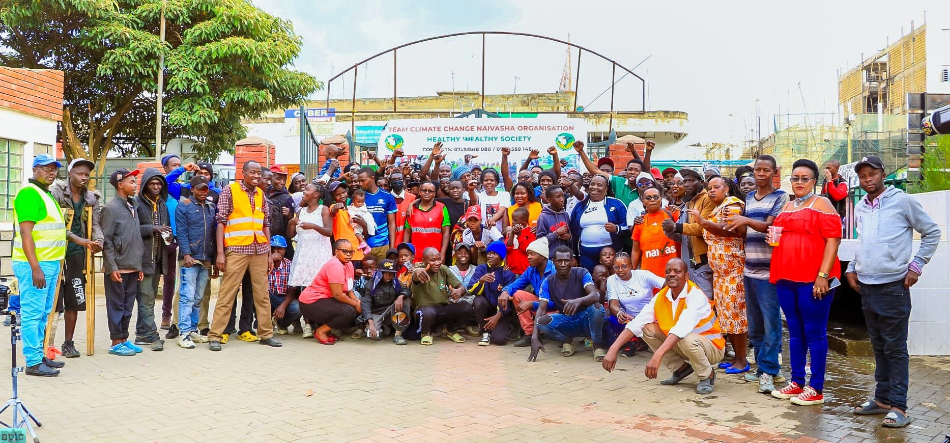 Team Climate Change Naivasha members and community participants taking part in a community environmental activity, demonstrating local action for climate resilience, conservation and sustainable development.