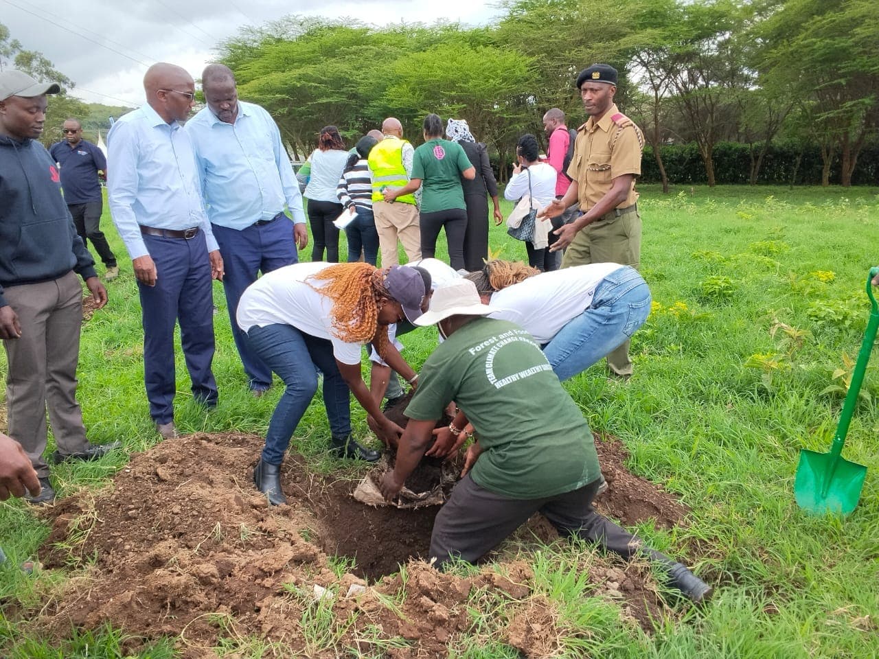 Members of Team Climate Change Naivasha and community members participating in a tree-growing and environmental conservation activity in Naivasha, working together to restore and protect the local environment.